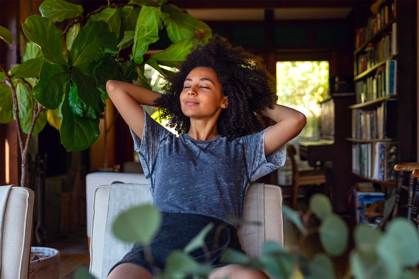 Woman Breathing happily by the window